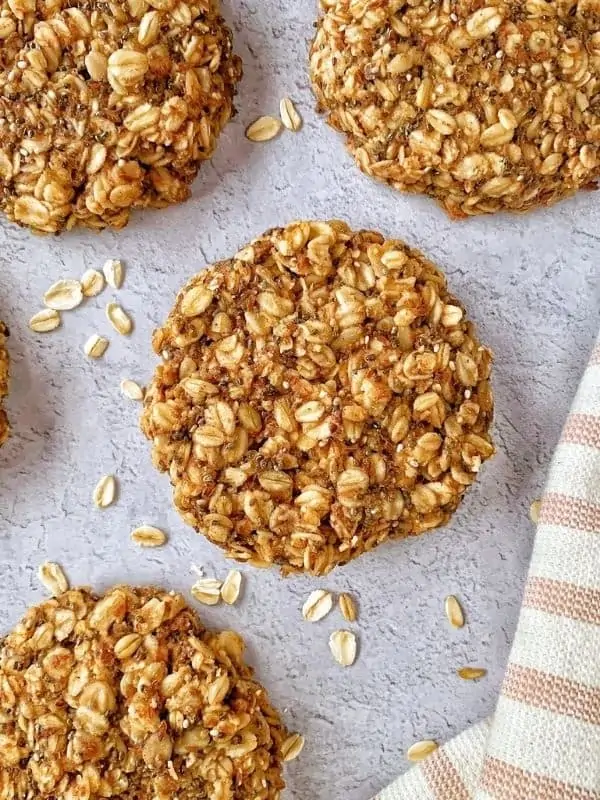 Oatmeal protein cookies are easy, vegan, & gluten-free! Using peanut butter, flax, & cinnamon, they make a yummy, & healthy breakfast option!