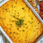 Healthy corn casserole from scratch is easy & the best Thanksgiving side! It's made without jiffy mix, & uses cornmeal & cream corn instead.
