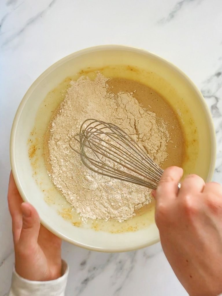 A mixing bowl with the ingredients for healthy protein donuts.