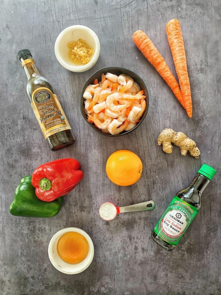 The ingredients needed to make honey orange shrimp with stir fry vegetables.