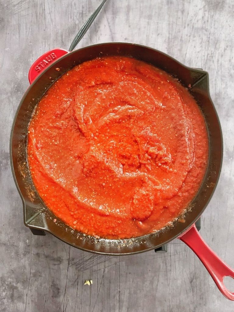 Marinara sauce from scratch in a cast iron skillet.