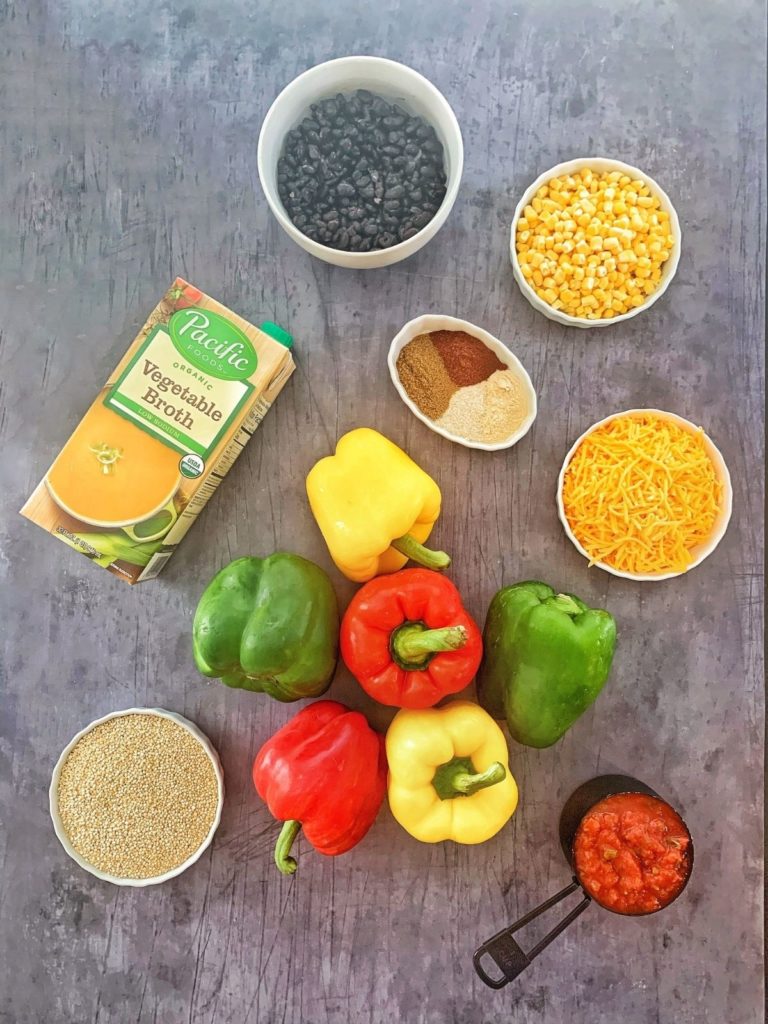 The ingredients needed to make quinoa stuffed bell peppers.