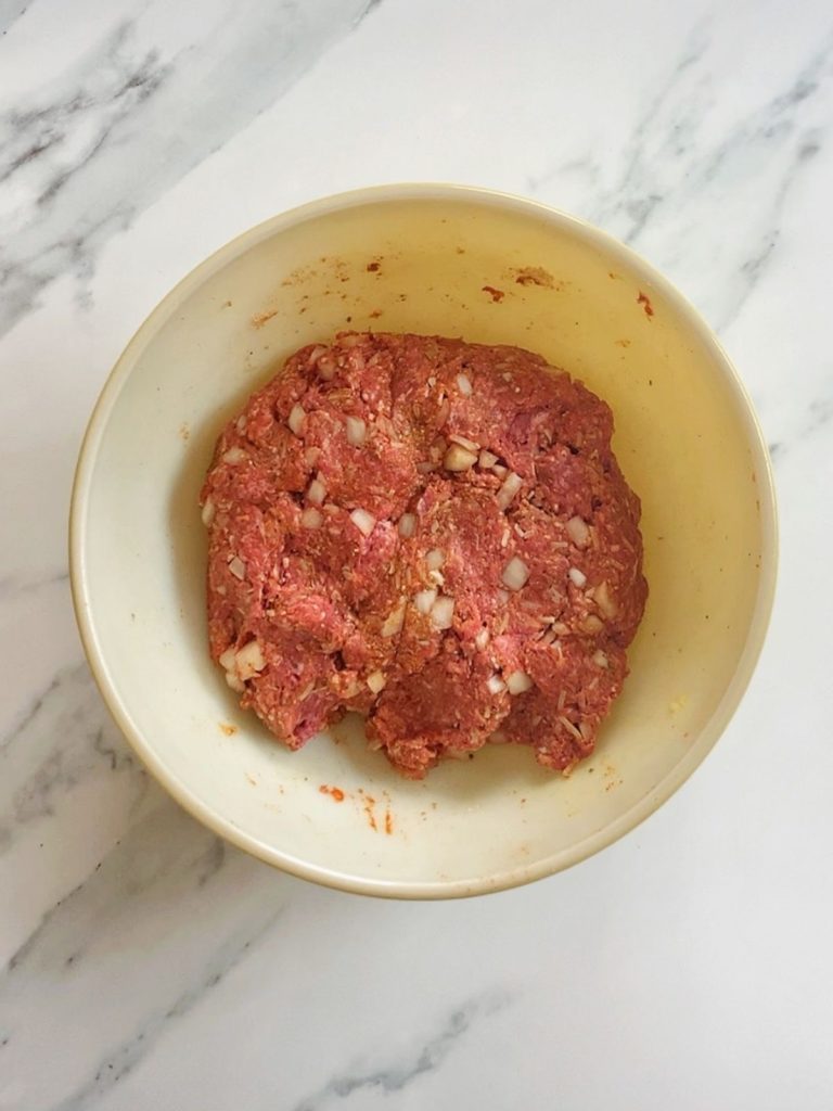 Meatball mixture combined in a large bowl.