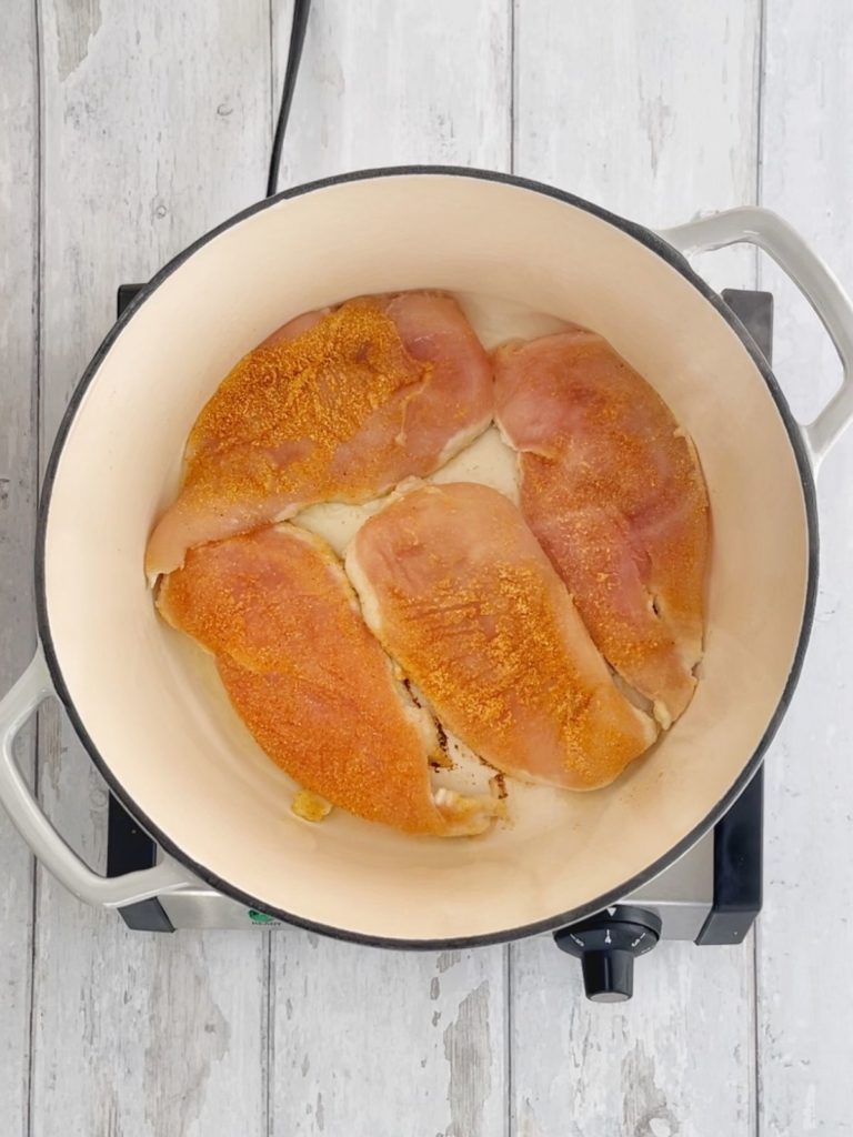 Chicken breasts in a dutch oven.