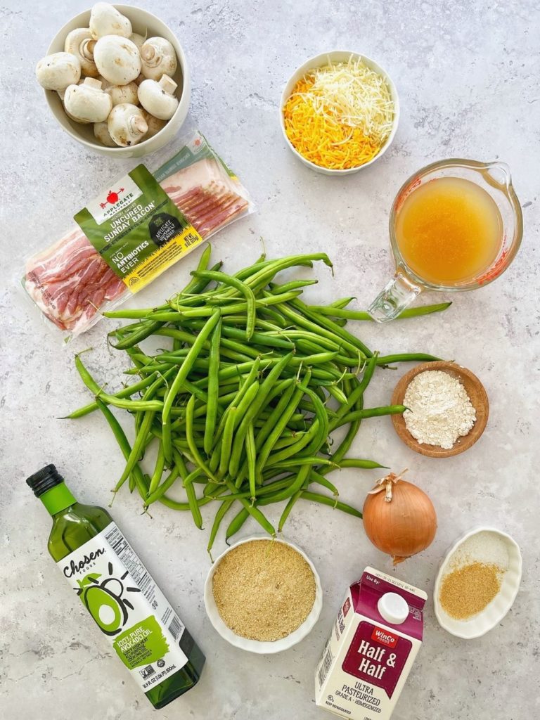 The ingredients needed to make cheesy bacon green bean casserole.