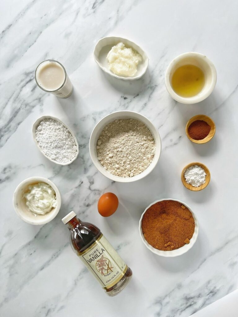 The ingredients needed to make baked cinnamon roll donuts.