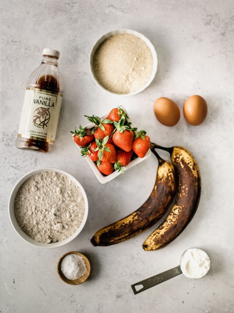 The ingredients needed to make strawberry banana bread.