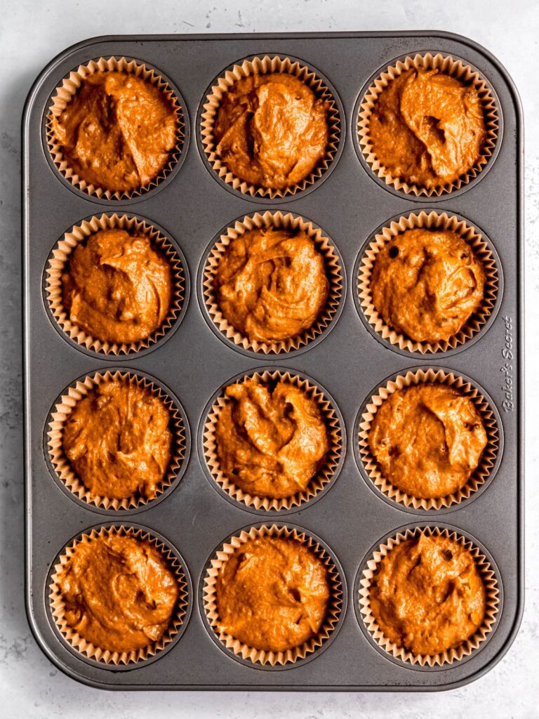 process shot - protein pumpkin muffin batter divvied up between 12 muffin liners.
