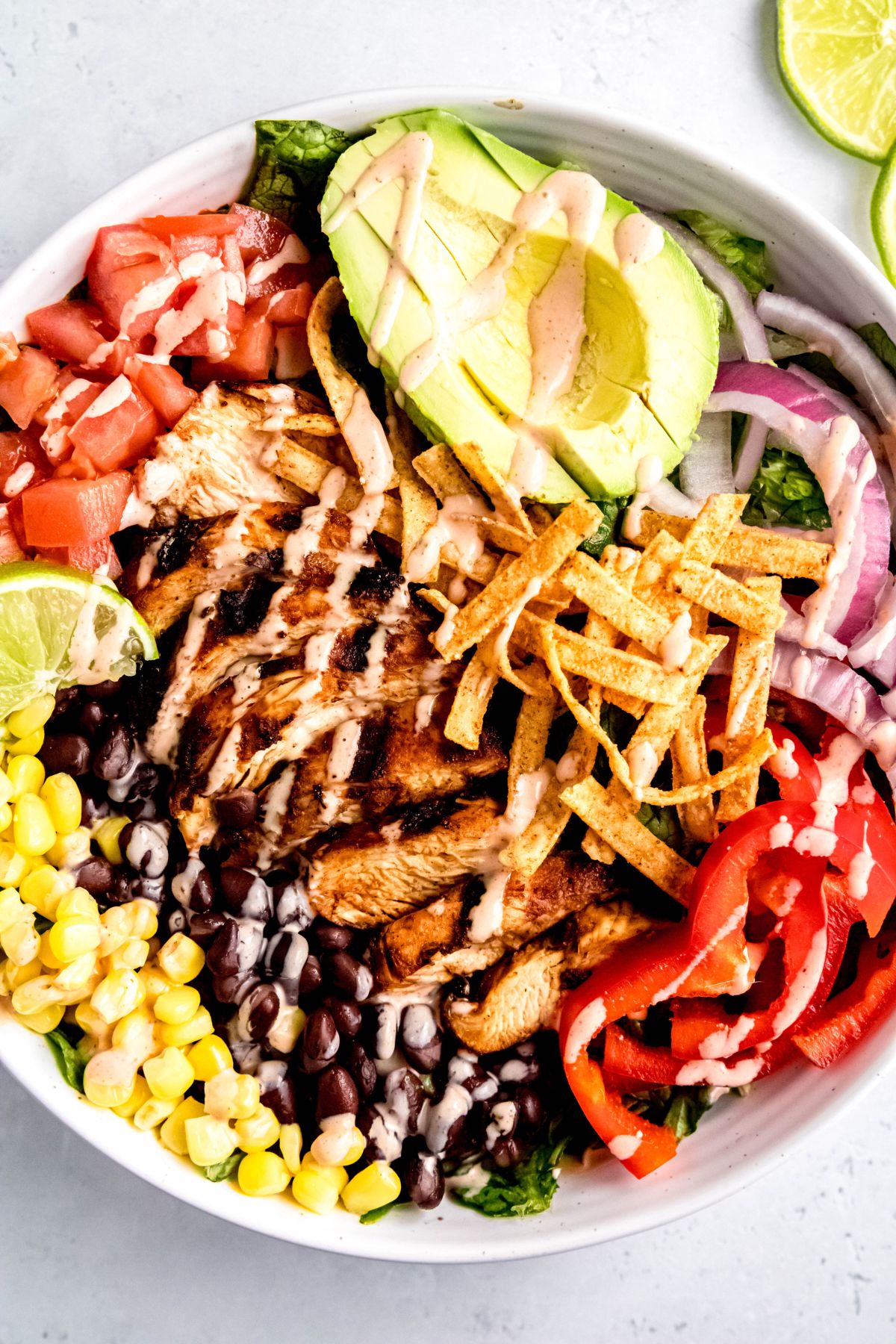 overhead shot of a spicy southwest chick fil a salad with grilled chicken.