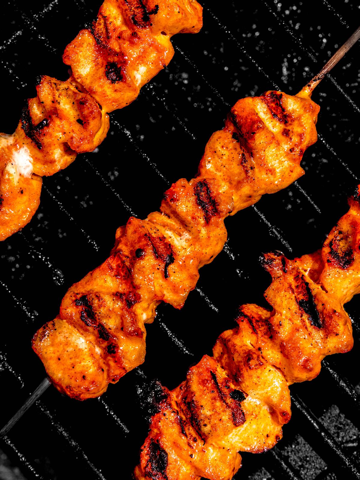 bang bang chicken skewers on the grill.