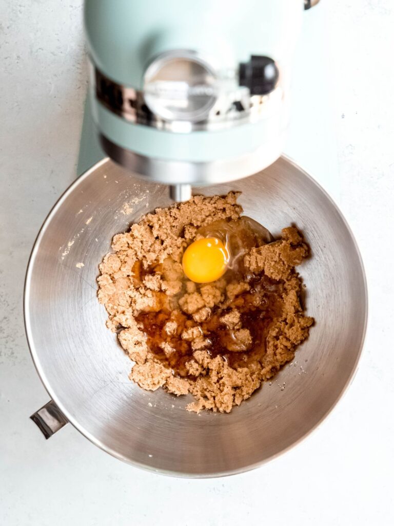 egg and vanilla added to the mixing bowl with the creamed butter and sugar.