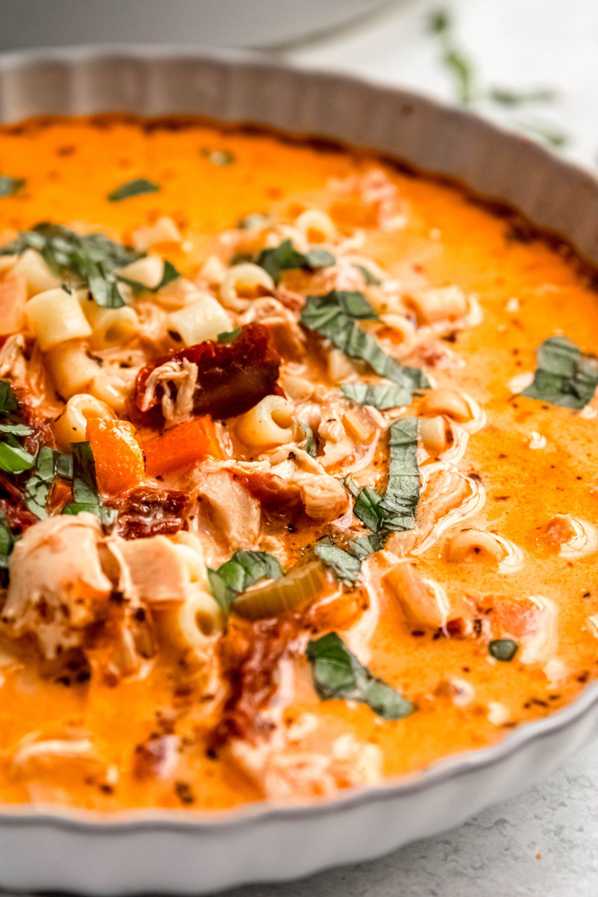 A close-up shot of a bowl of marry me chicken soup.