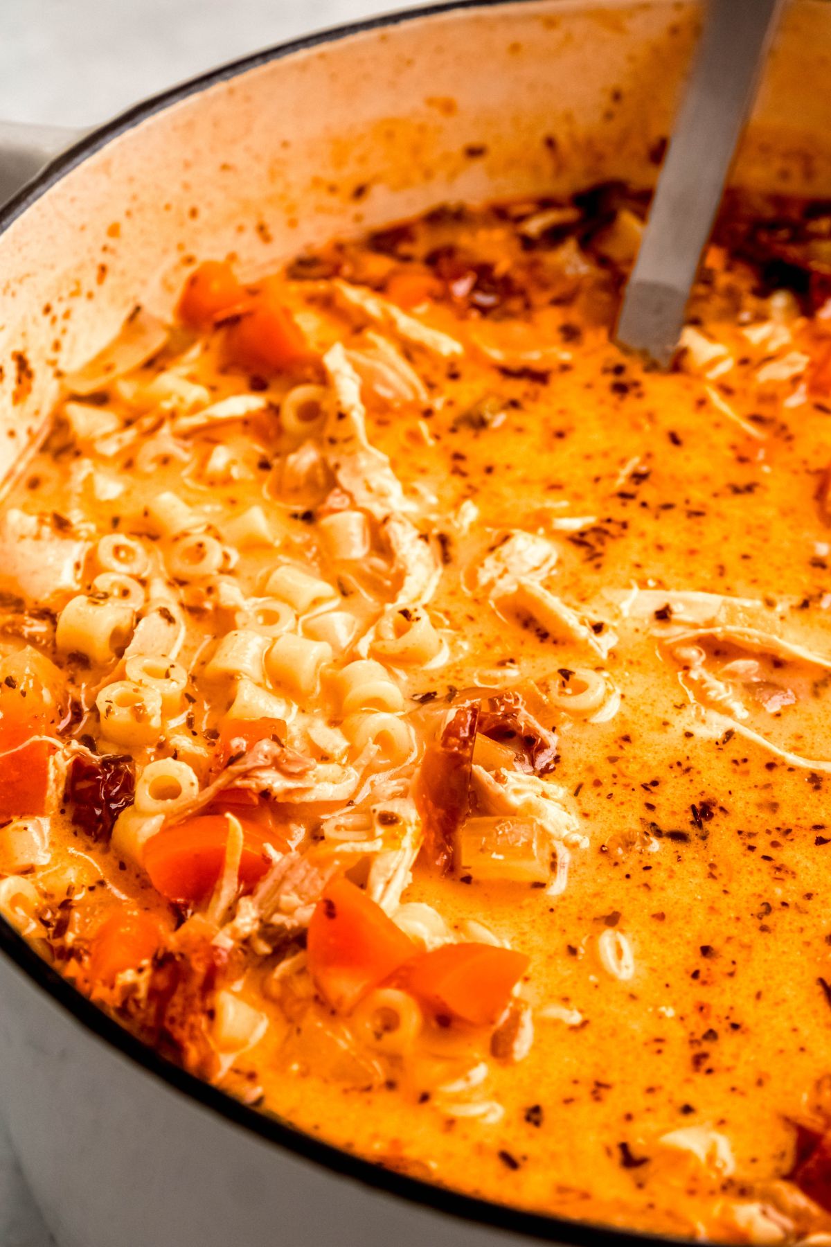 A close-up shot of a pot of cooked Marry Me Chicken soup.