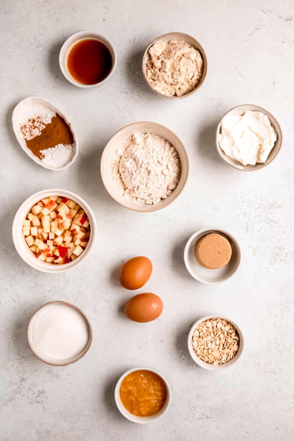 All of the ingredients to make apple cinnamon protein muffins on the counter.