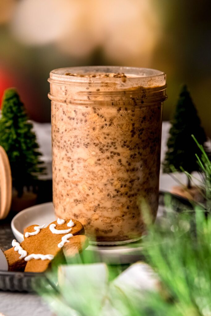 gingerbread protein oats in a mason jar after mixing the liquid in but before refrigerating.