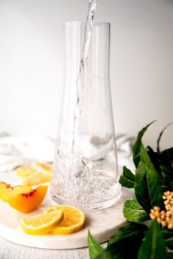 water being poured into a pitcher.