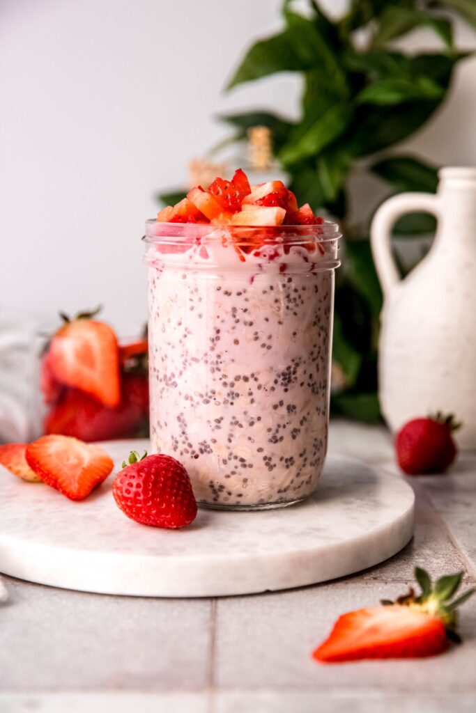 strawberry protein overnight oats after refrigerating until the chia seeds and oats rehydrated and topped with fresh strawberry chunks for serving.