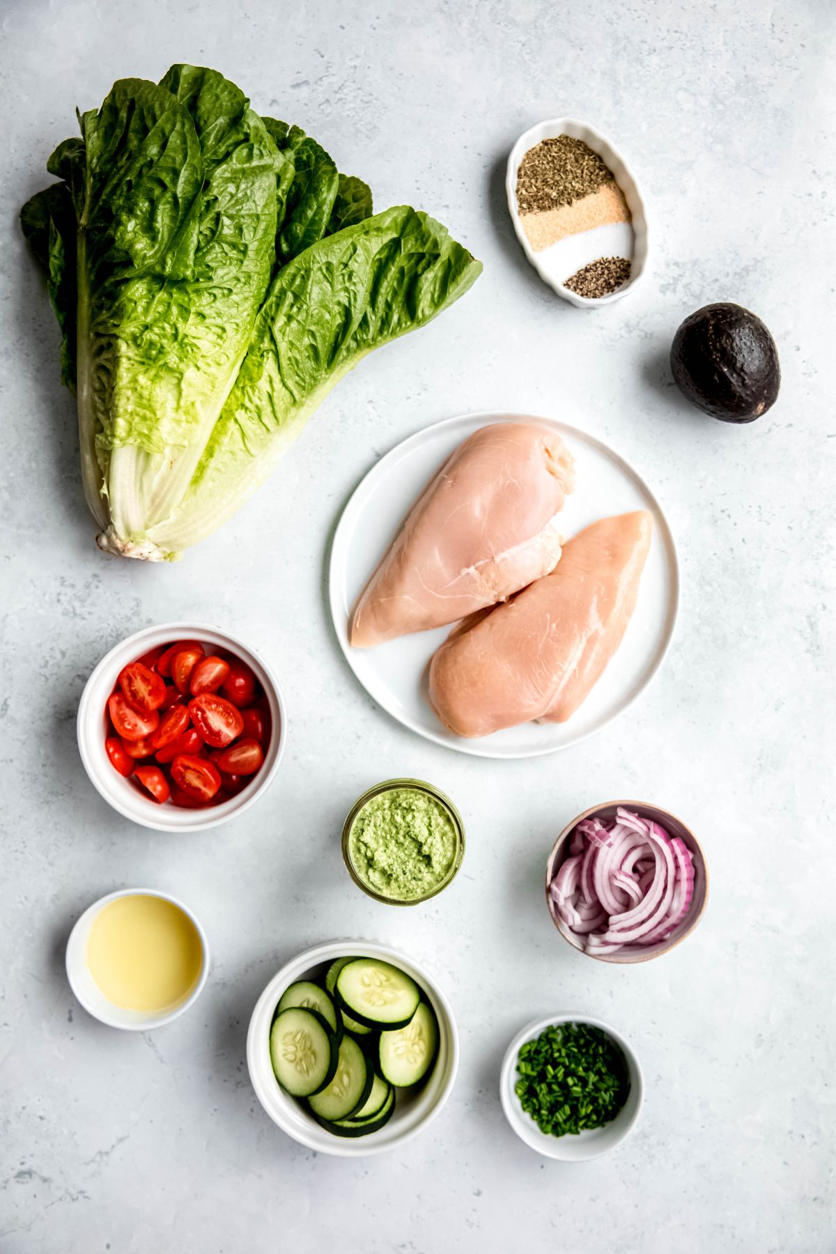 The ingredients to make chicken green goddess salad on the counter.