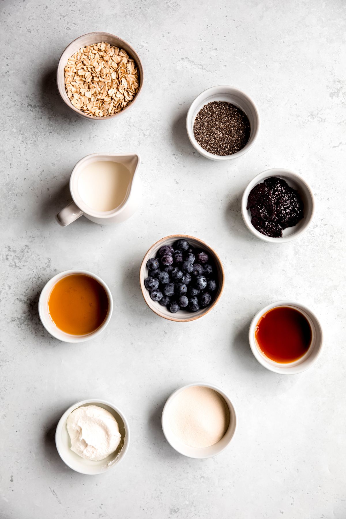 An overhead shot of the ingredients needed to make high protein blueberry overnight oats.