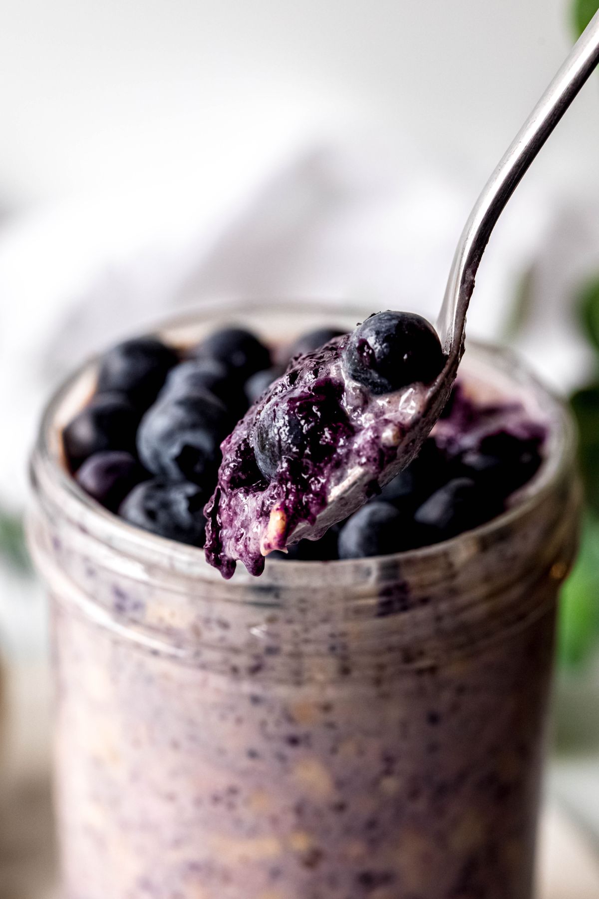 A close-up shot of a spoonful of the blueberry overnight oats.