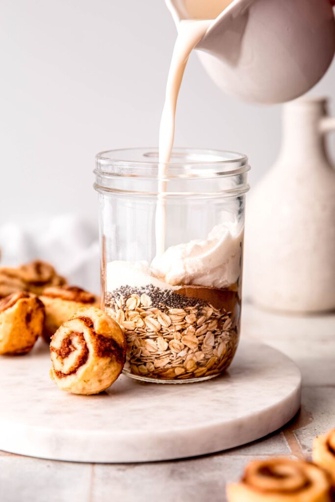 Adding the milk and Greek yogurt to the oats.