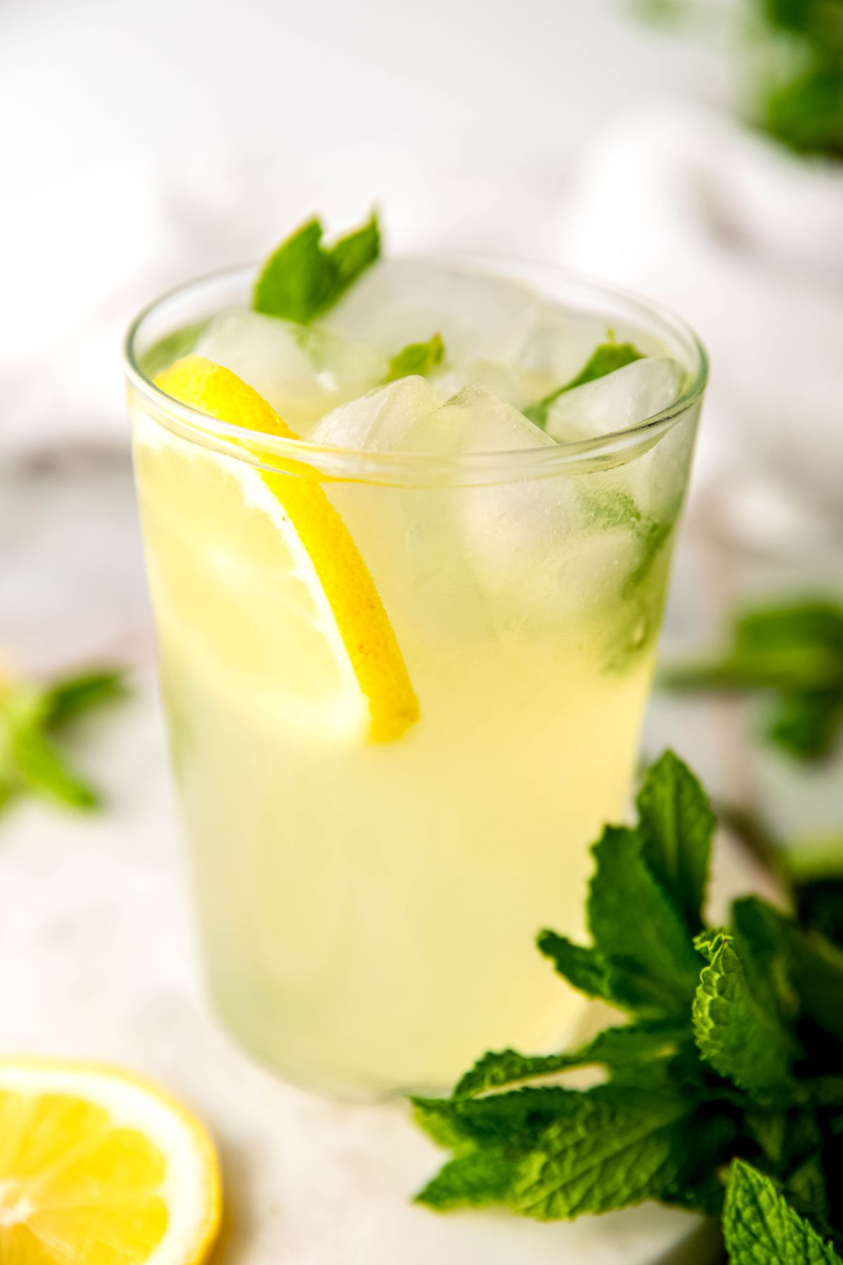closeup hero on a glass of lemonade with mint.