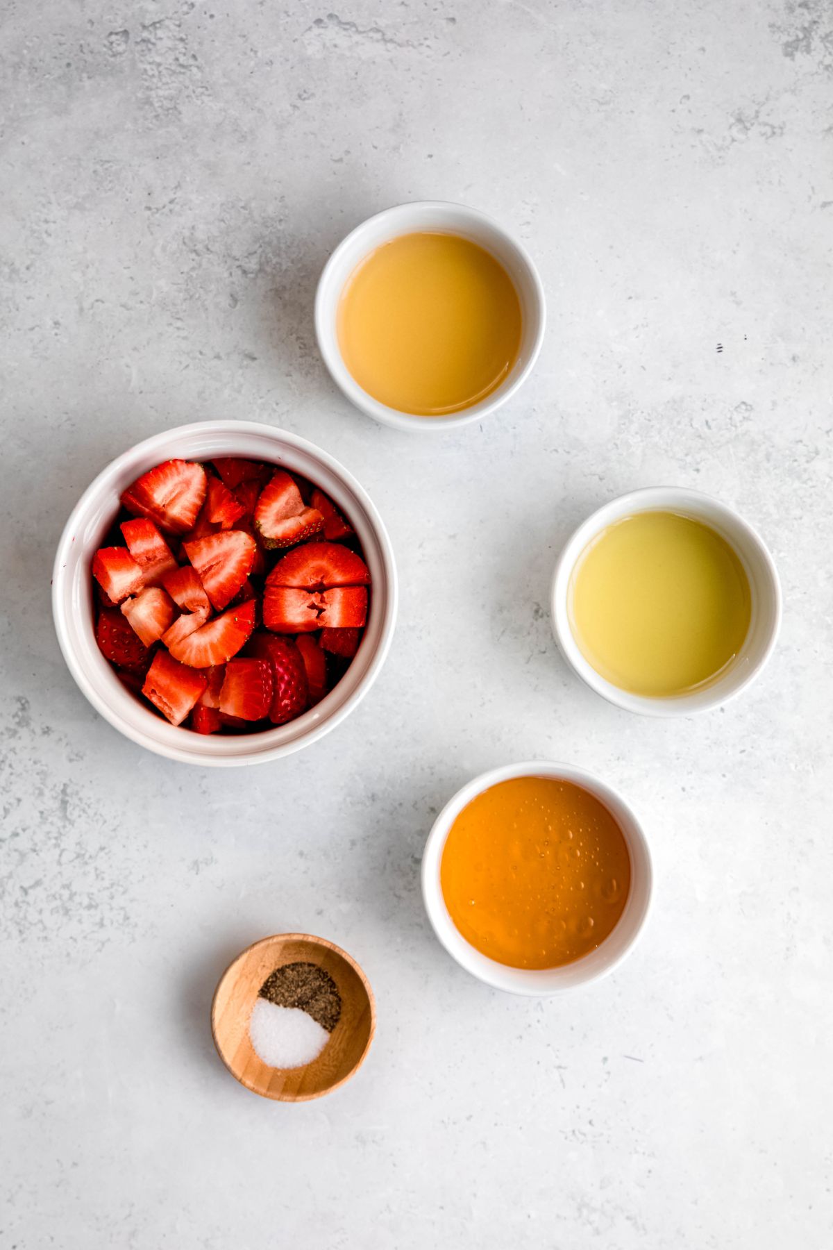 An overhead shot of all the ingredients needed to make homemade vinaigrette.