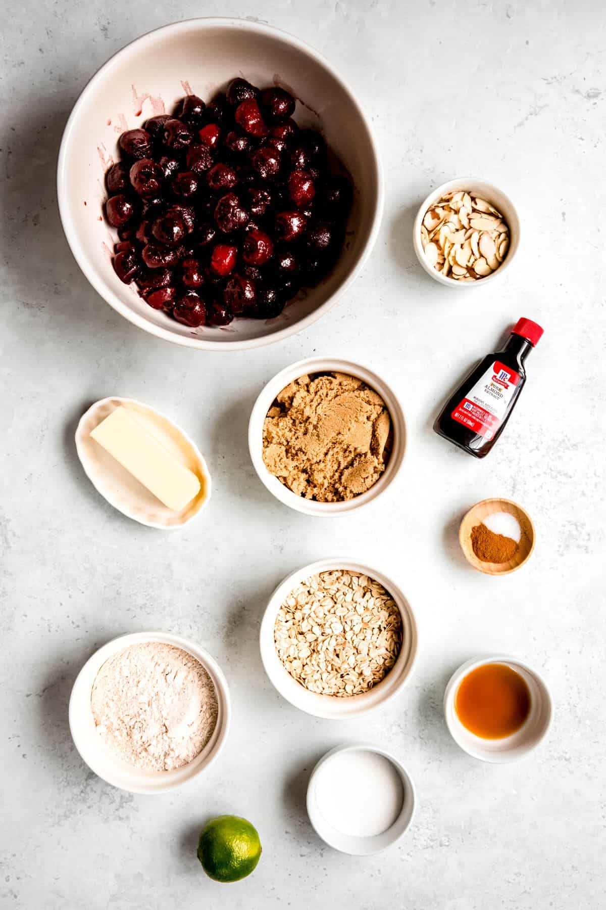 An overhead shot of the ingredients to make cherry crisp on the counter.