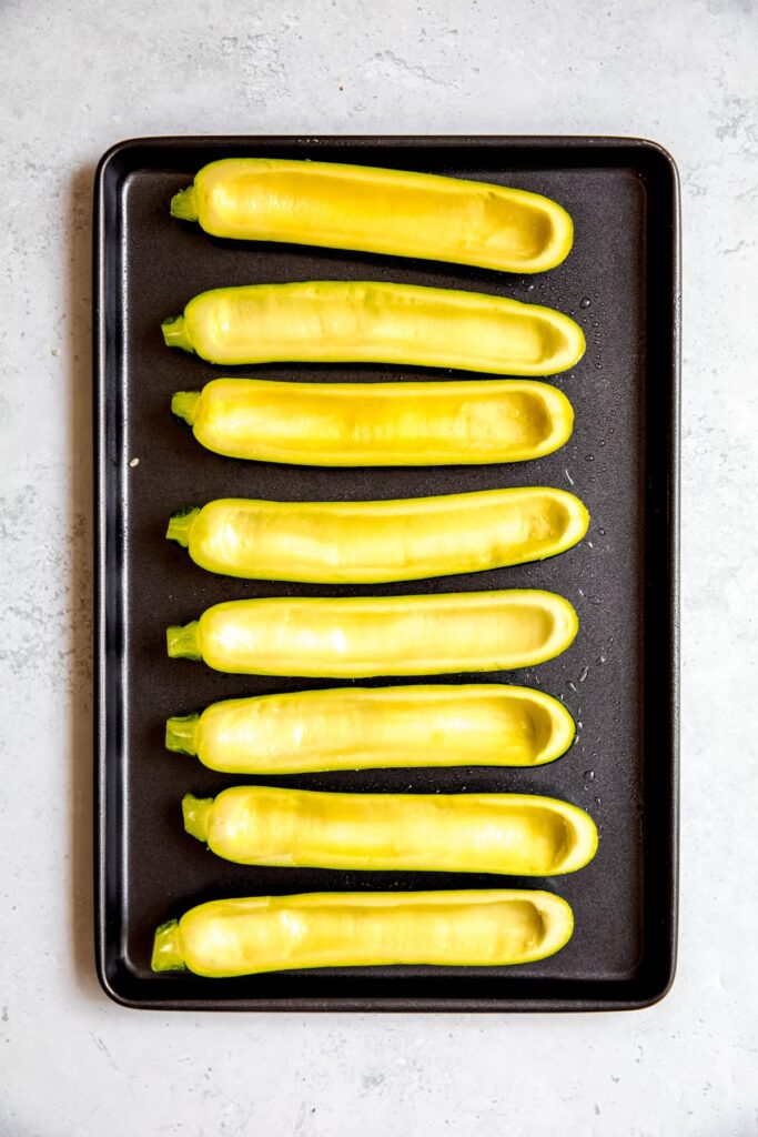 An overhead shot of the hallowed-out zucchinis after roasting.