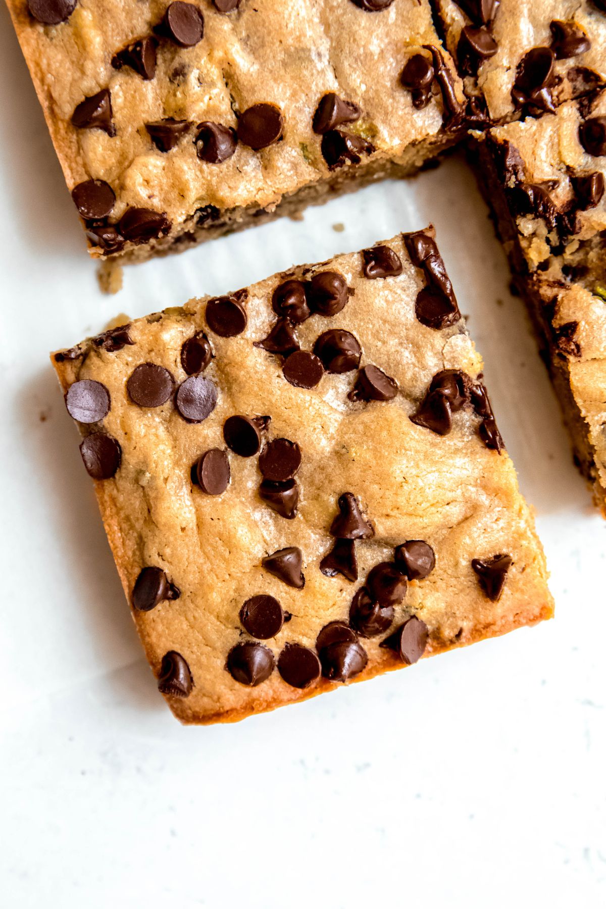 A close-up overhead shot of a zucchini bar cut from the pan.