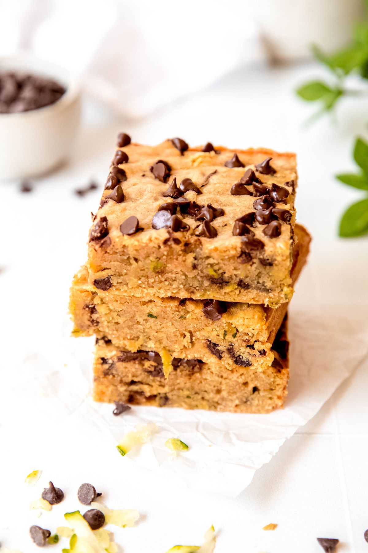 A close-up angled shot of a stack of zucchini bars on the counter.
