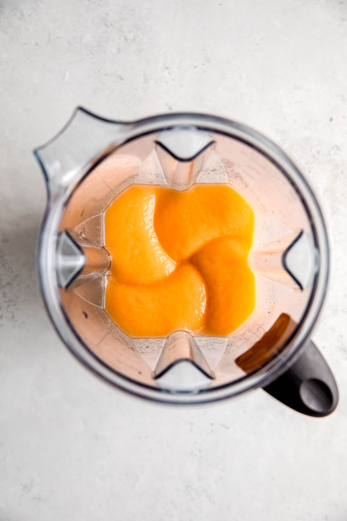 peach sorbet after blending in the blender but before freezing.