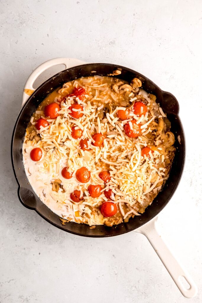 The onion and mushroom mixture with cream and shredded parmesan cheese.