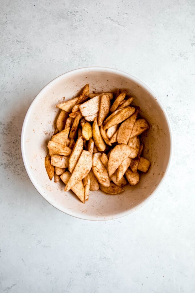 pear crisp filling after mixing with the cinnamon, vanilla, cornstarch, and brown sugar.