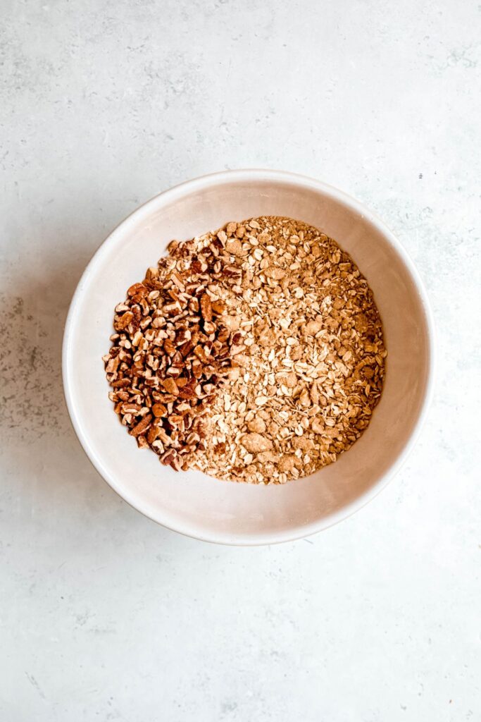 pecans added to the bowl with the buttery crisp topping.