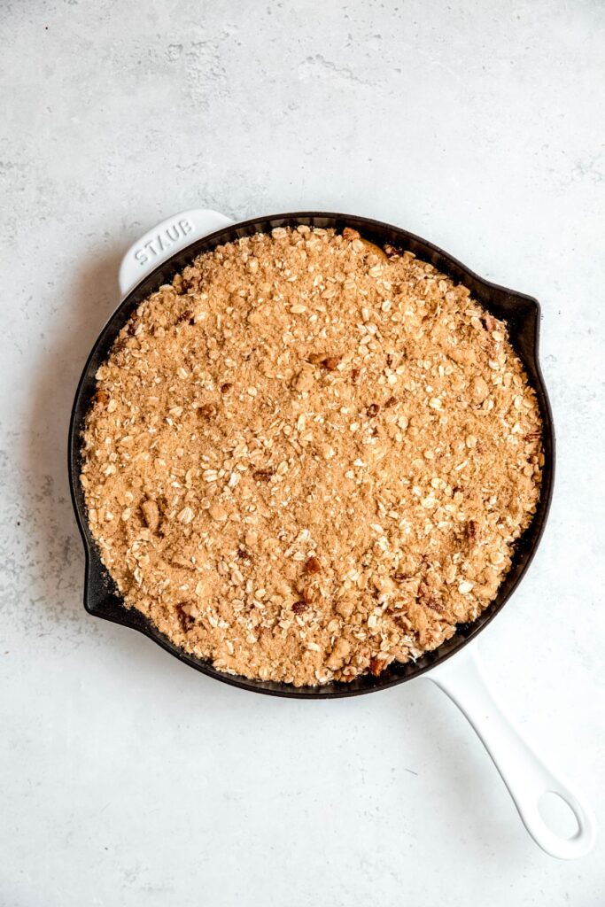 pecan oat crisp topping sprinkled on top of the pear filling.