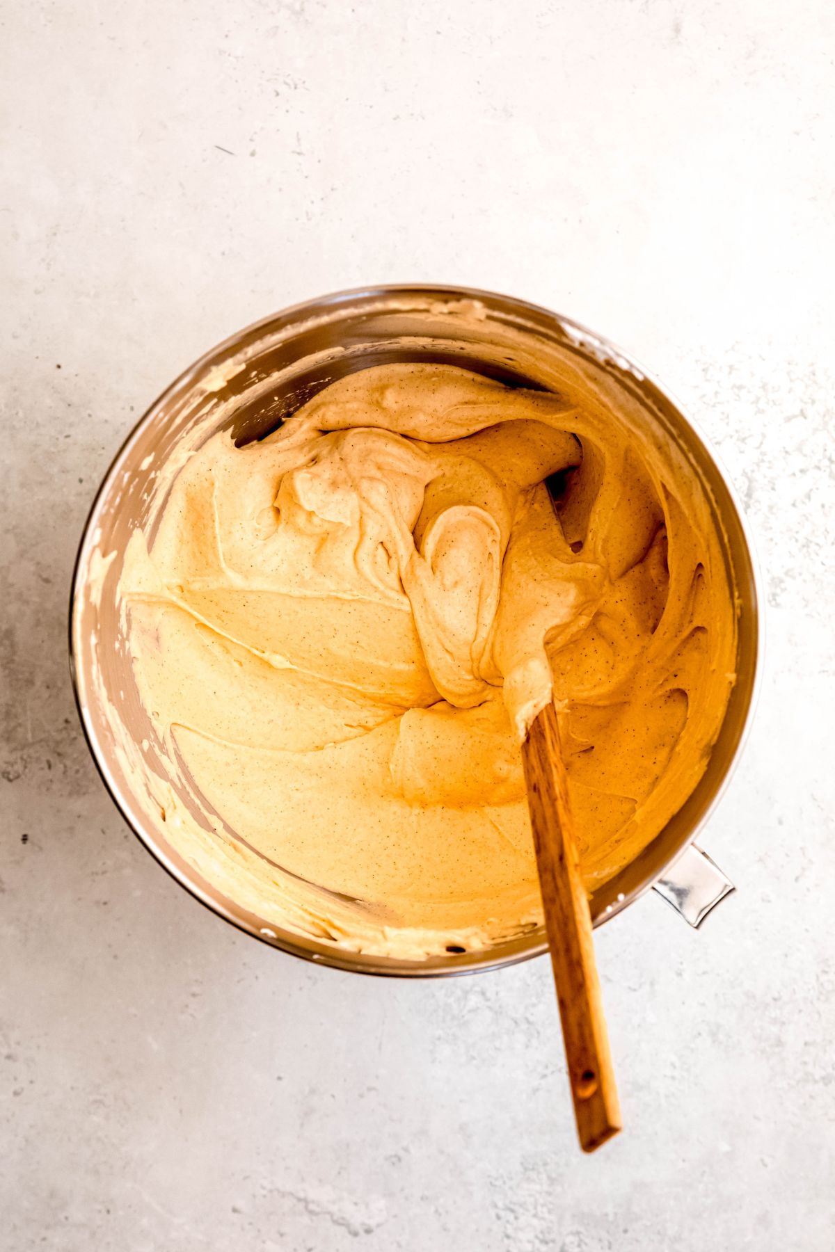 protein pumpkin fluff in the mixing bowl after folding the pumpkin mixture and whipped cream together.