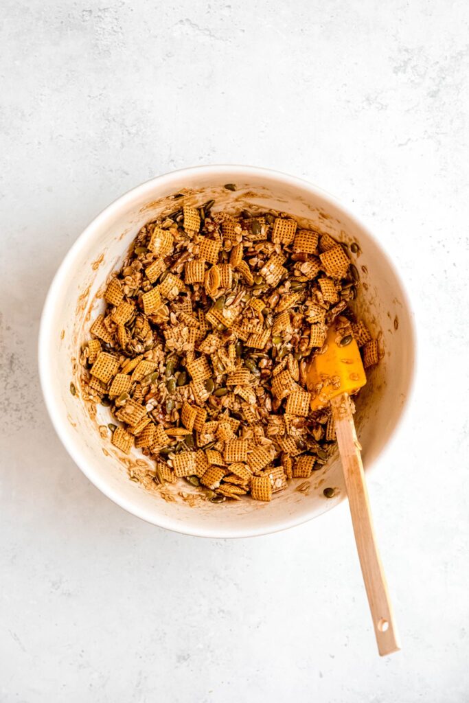 raw pumpkin spice chex mix after tossing with the maple glaze.