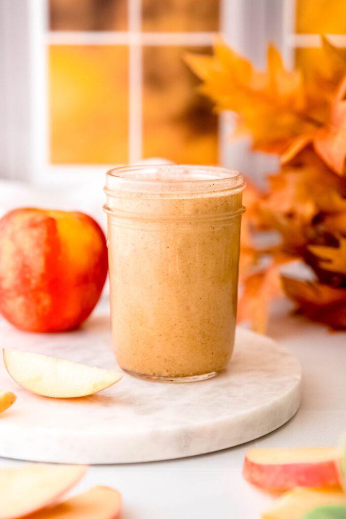 creamy, emulsified apple cider vinaigrette in a mason jar after blending.