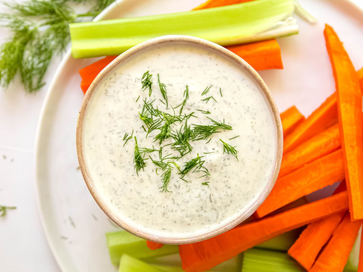 A horizontal shot of a small dish of Greek yogurt salad dressing.