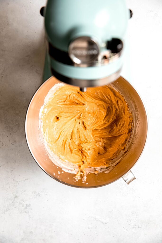 The whipped pumpkin cheesecake mixture in a stand mixture.