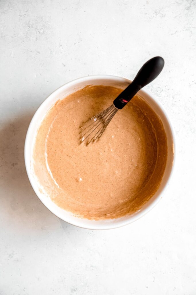 apple cider doughnut batter after whisking the wet and dry ingredients together.