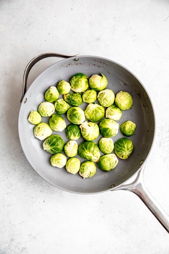 halved raw brussels sprouts placed cut-side down in the same skillet that the bacon cooked in.