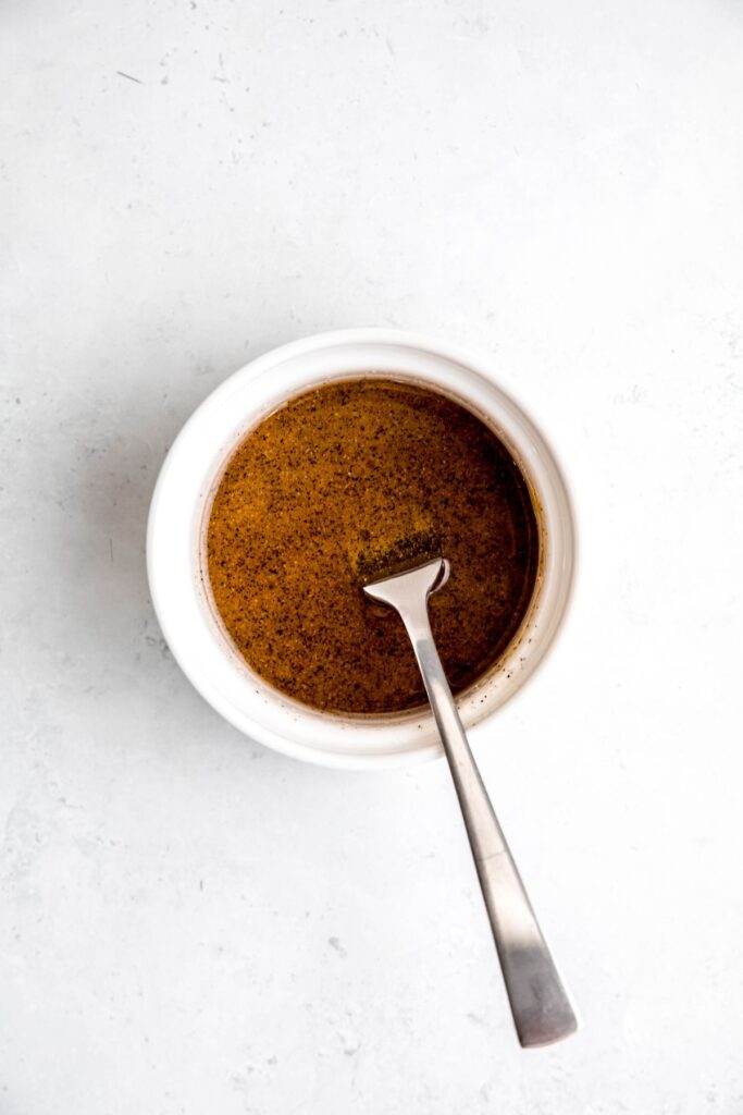 maple dijon glazing sauce mixed together in a small mixing bowl.