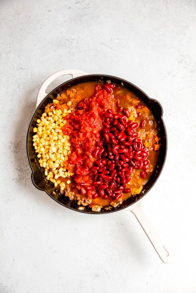 The chili in the skillet before simmering.