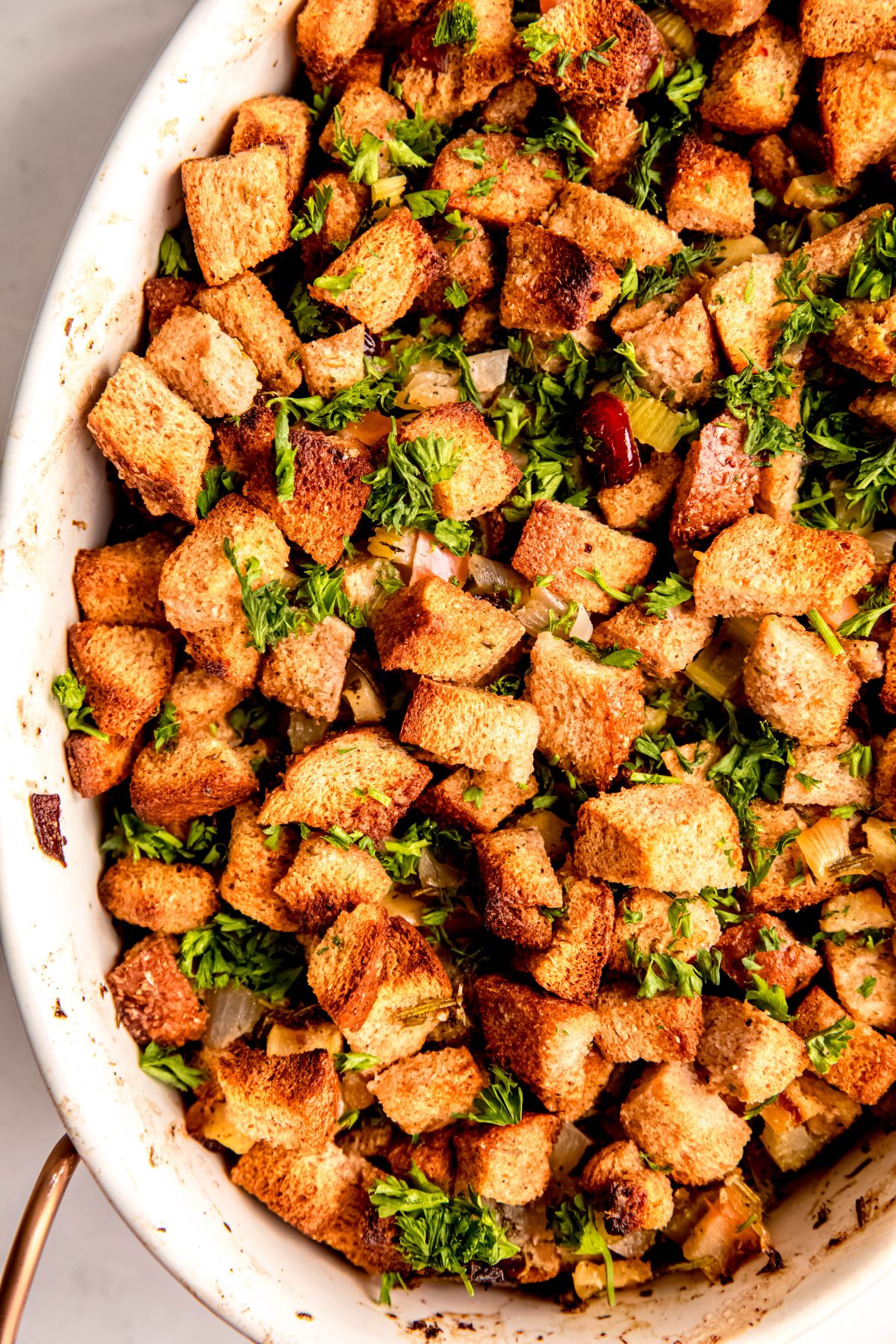 closeup overhead shot of whole wheat stuffing that was made ahead and baked before serving.