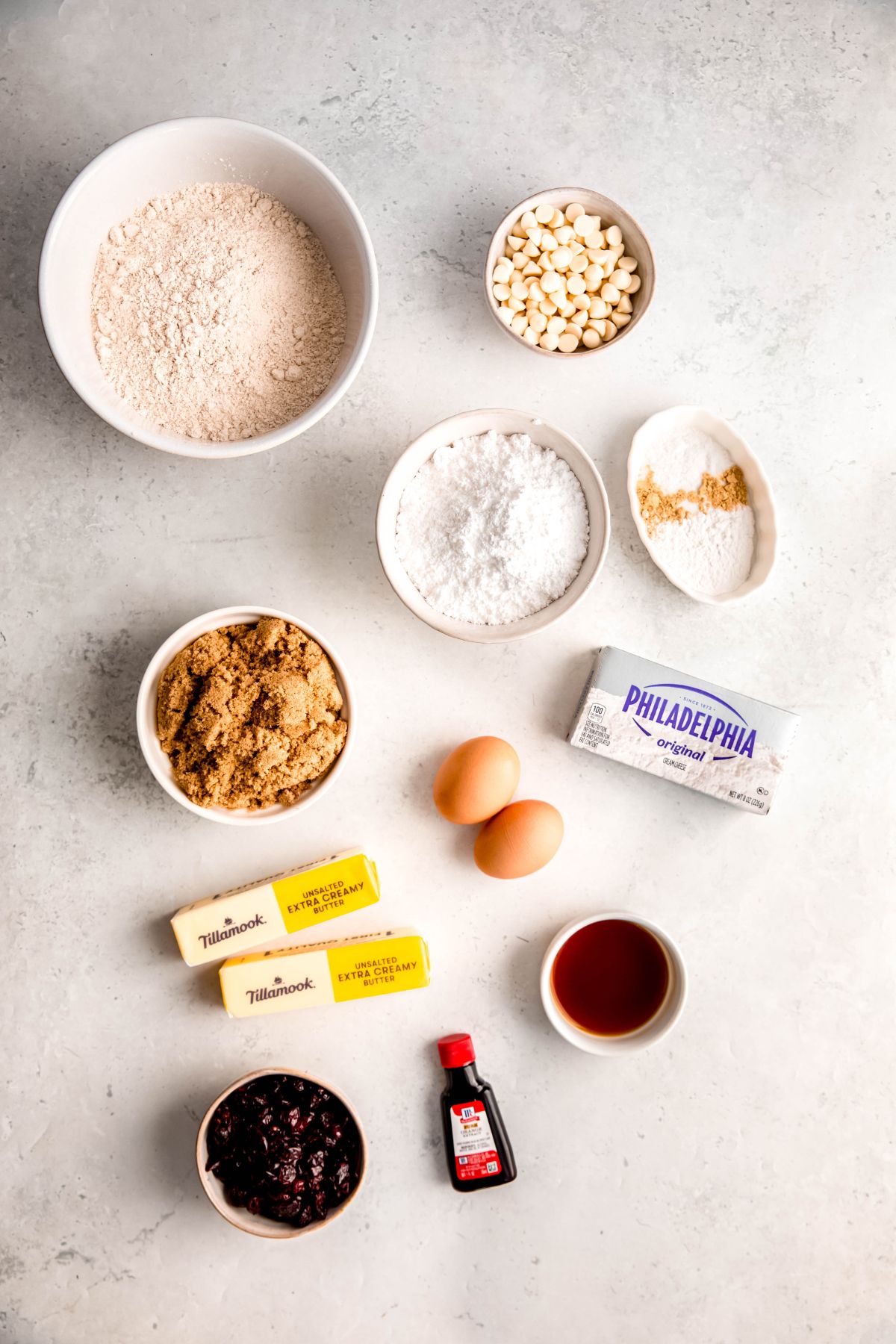 ingredients needed to make copycat starbucks cranberry bliss bars recipe measured out on a white table.