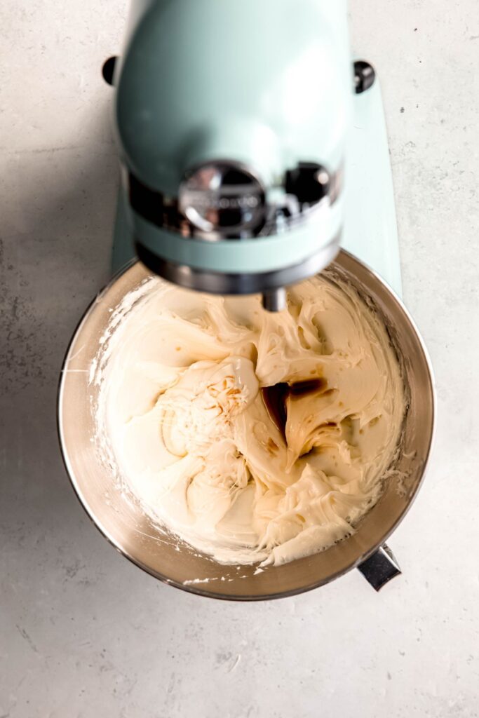 cream cheese frosting in the mixing bowl after whipping and adding the extracts.