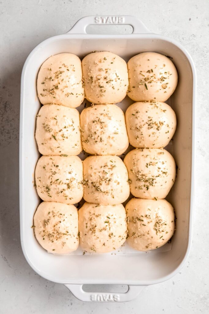 garlic rosemary seasoning mixture sprinkled on top of the raw dough, using the egg wash to make it stick.