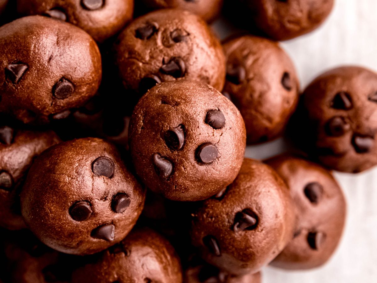 horizontally framed hero shot of a pile of homemade healthy chocolate protein balls.